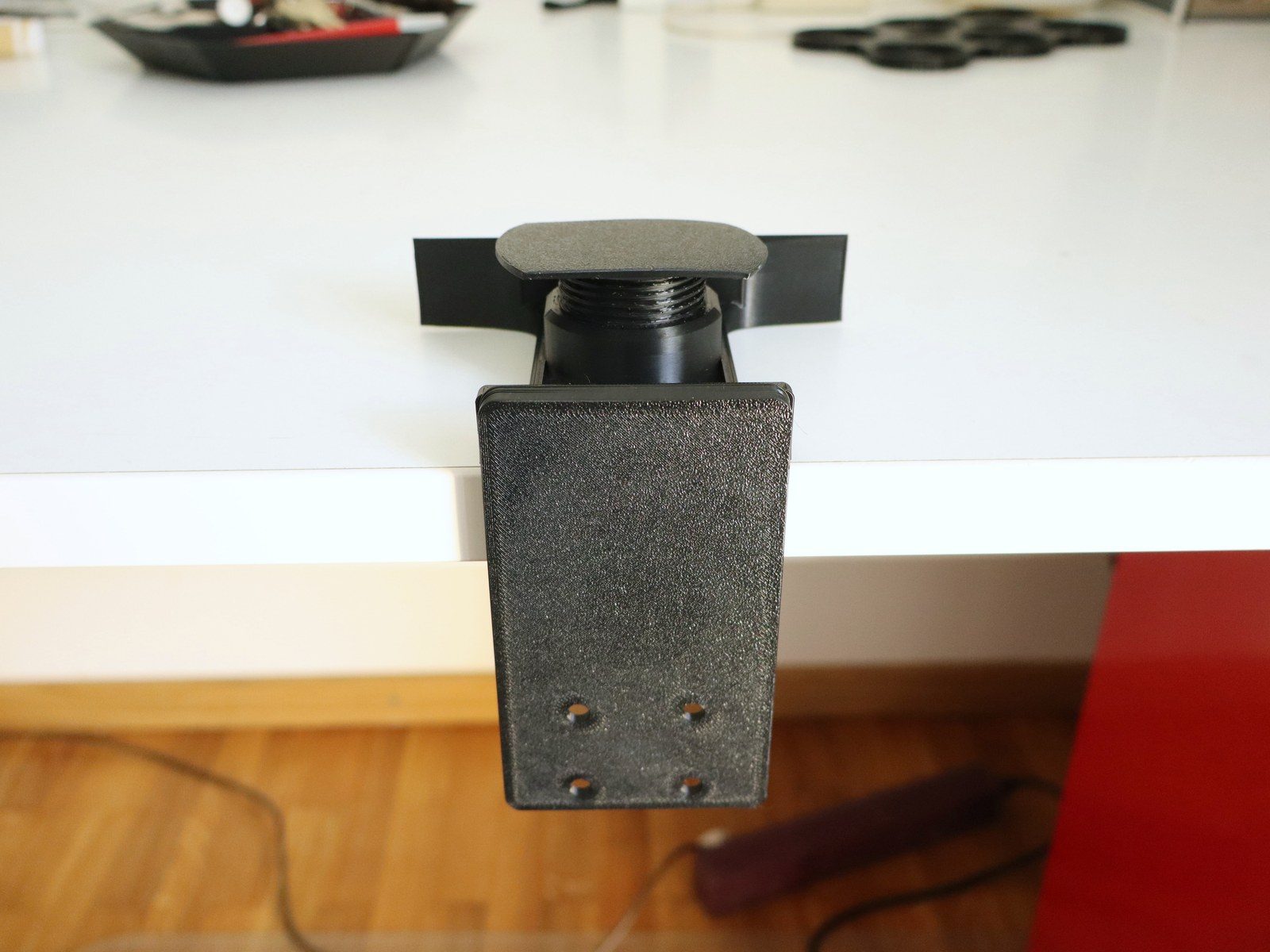 Photo - Shown on a table top, the screw sits on top